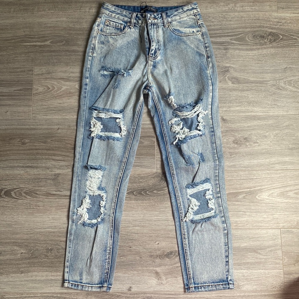 High-rise destructed denim from White Fox boutique. Size medium (size 4)